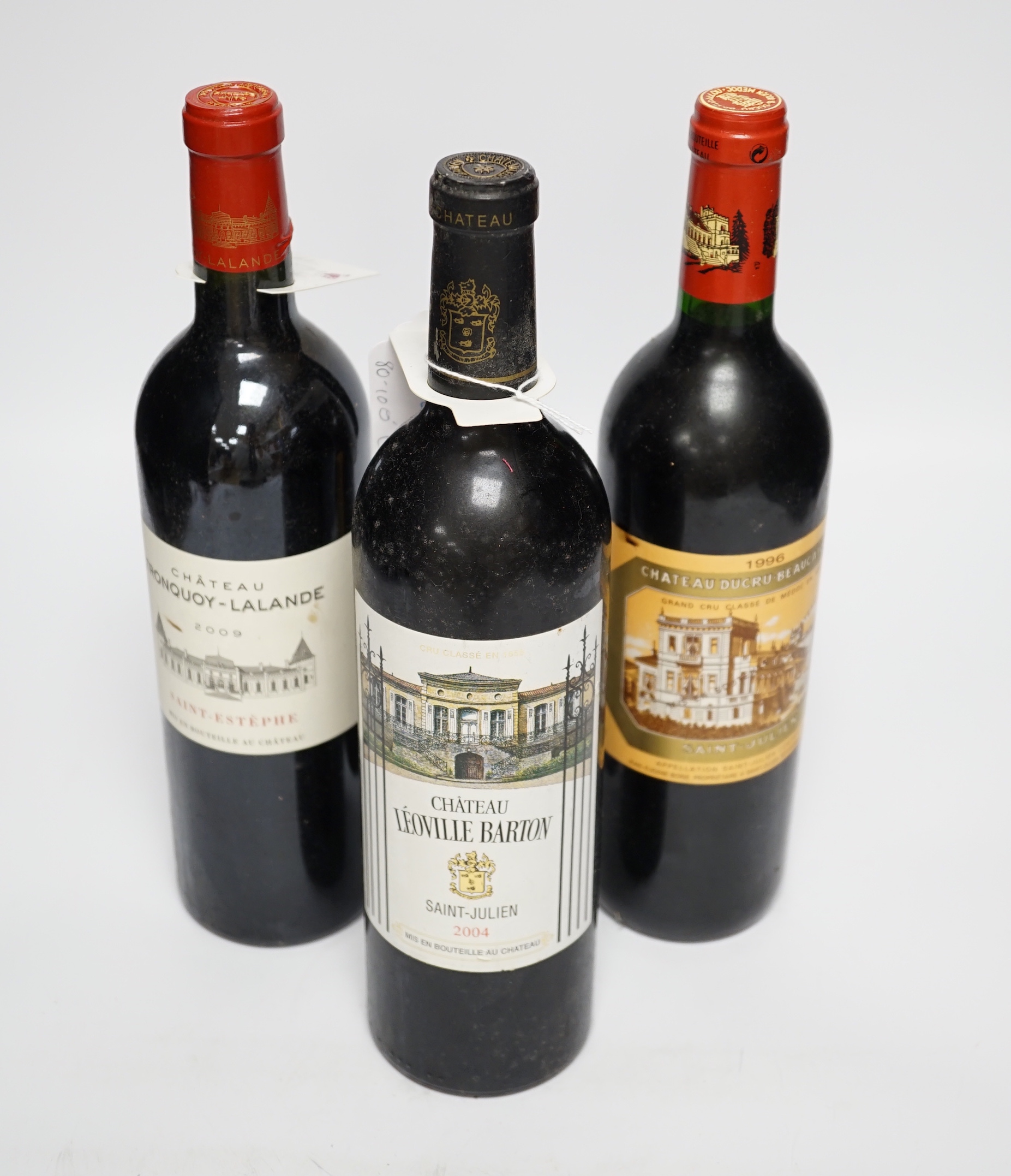 One bottle of Chateau Ducru-Beaucallou, Saint- Julienne grande cru classe Medoc 1996, one bottle of Chateau Leoville Barton Saint-Julienne 2004 and one bottle of Cateau Tronquoy-Lalande, Saint-Estelle 2009 (3)